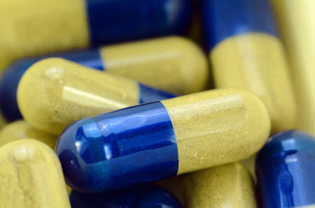 Dried herbal medicine in capsule.の写真素材