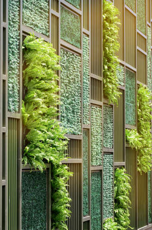 Green Wall with Vertical Demo Gardenning in Warm Light Tone.