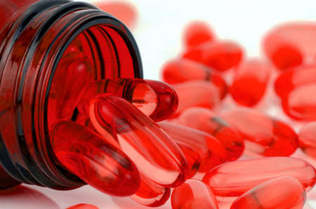 Red soft gelatin capsule use in pharmaceutical manufacturing for contain oily drug and nutritional supplement like vitamin A, E, fish oil, primrose oil, rice barn oil and other oily drugs.の写真素材