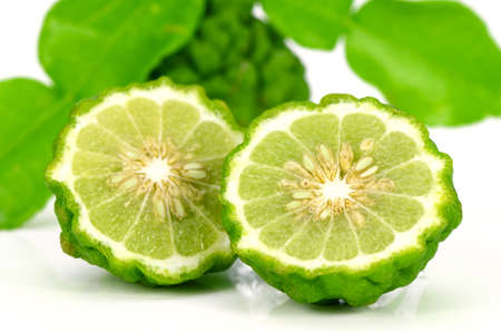 Fresh Fruits and Green Leaves of Kiffir lime or Leech lime (Citrus hystrix DC.) on White Background.の写真素材