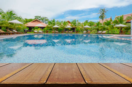 Blurred Swimming Pool Background with Perspective Wood Floor.のeditorial素材