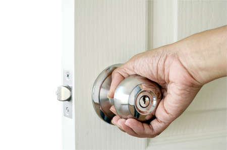 Right hand open the door isolated on white background with clipping path.の写真素材