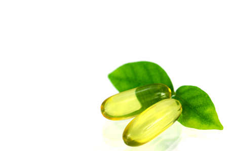 Yellow soft gelatin capsule in natural products concept.の写真素材