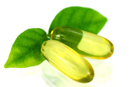 Yellow soft gelatin capsule in natural products concept.の写真素材
