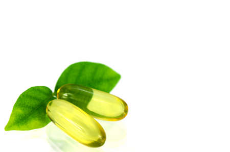 Yellow soft gelatin capsule in natural products concept.の写真素材