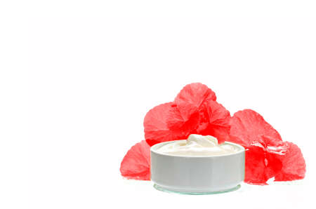 Centella asiatica leaves and skincare product in red and white tone. Indian pennywort (Centella asiatica (L.) Urban.) anti-aging skin care product.の写真素材