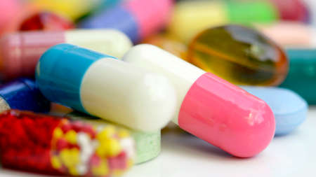 Colorful of oral medications on White Background.の写真素材