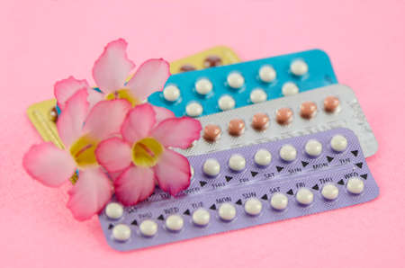 Oral contraceptive on pink background in women health concept.の写真素材