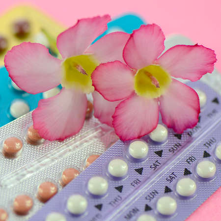 Oral contraceptive on pink background in women health concept.の写真素材