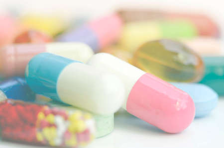 Pharmacy background. Colorful of oral medications on White Background.の写真素材