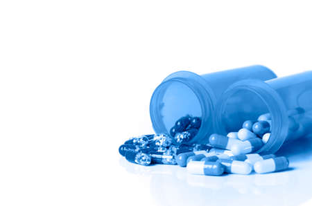 Medicine in light protected bottle. Capsules in orange bottle. Refill prescription concept.の写真素材