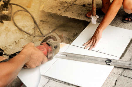Home renovation. Tile cutting and flooring.