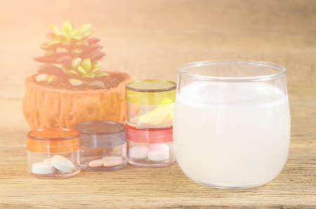 oral medication on wood background with soft light.の写真素材