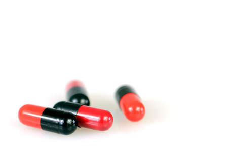 Oral Antibiotics in hard gelatin capsule on white background.