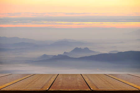Perspective wood table with mountain and the mist view.の写真素材