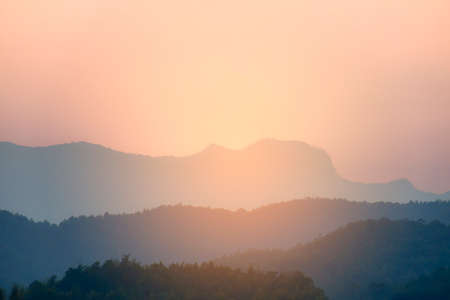 Sunset - sunrise  with layer of mountain.の写真素材