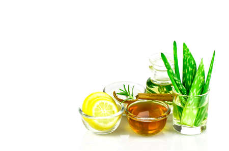 Aloe Vera, Lemon, greek yogurt, honey, rosemary, sea salt and essential oil homeopathy remedy recipe on whiteの写真素材