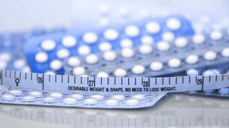 Contraceptive pill  in concept of no weight gain effect.の写真素材