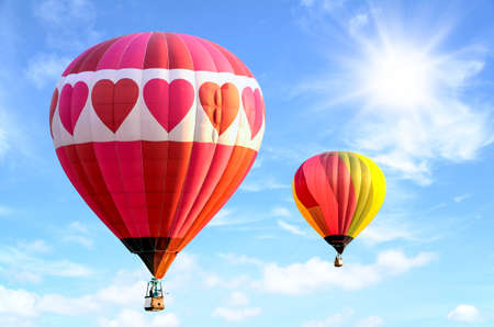 Colorful hot air balloon over bright sky with clouds. Hot air balloon and blue skyの写真素材