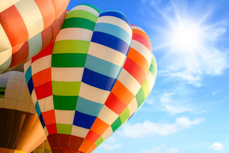 Colorful hot air balloon over bright sky with clouds. Hot air balloon and blue skyの写真素材