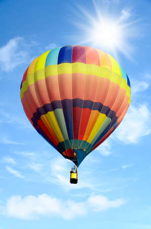 Colorful hot air balloon over bright sky with clouds. Hot air balloon and blue skyの写真素材