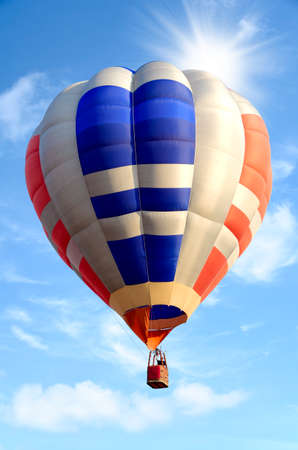 Colorful hot air balloon over bright sky with clouds. Hot air balloon and blue skyの写真素材