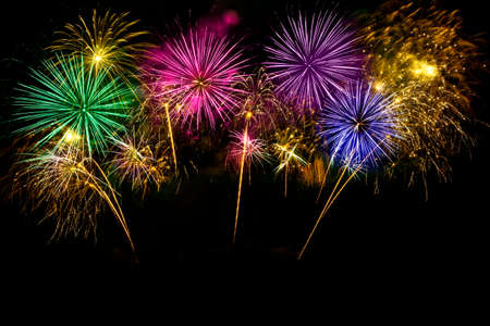Colorful fireworks celebration and the midnight sky background.の写真素材
