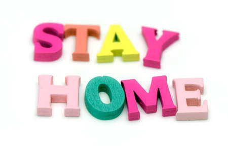 Pastel words STAY HOME on white background for avoid COVID-19 infection campaign.の写真素材