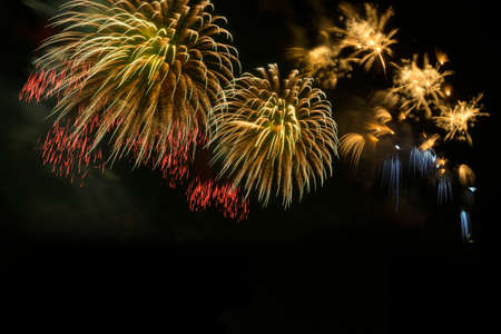 Colorful fireworks celebration and the midnight sky background.の写真素材