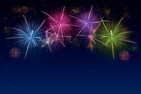 Colorful fireworks celebration and the twilight sky background with copyspace at the bottom of image.の写真素材