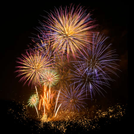 Colorful fireworks celebration and the midnight sky background.の写真素材