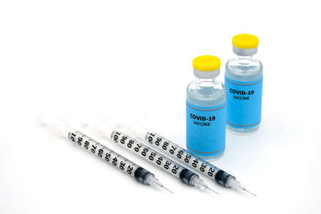 Sample of  Vaccine vials with syringe and needle on white background in concept of booster vaccine.の写真素材