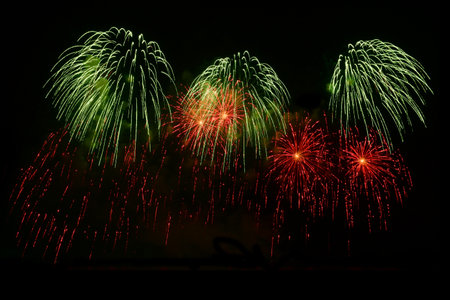 Colorful Fireworks Isolated on black sky background. Isolated firework ready to use for decoration in any photograph ,poster, backdrop to celebrate the festival, Christmas,  New year and any events.の写真素材