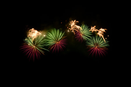 Colorful Fireworks Isolated on black sky background. Isolated firework ready to use for decoration in any photograph ,poster, backdrop to celebrate the festival, Christmas,  New year and any events.の写真素材