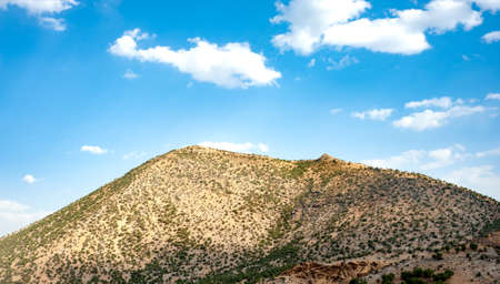 Rocky Mountains with oak trees and cloudy sky, Rocky Mountain khuzestan province, Iranの写真素材