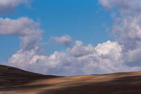 view from Nature and landscapes of dasht e lut or sahara desert after the rain with wet sand dunes and cloudy sky. Middle East desertの写真素材