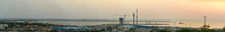 chabahar, iran 27 october 2021, panorama view from the international Port of Shahid Beheshti in chabahar with cargo ships at sunset, iranのeditorial素材