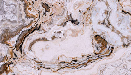 Beige marble pattern with curly white and orange veins. Abstract texture and background. Soft...