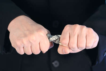 Squeeze and save moneyの写真素材