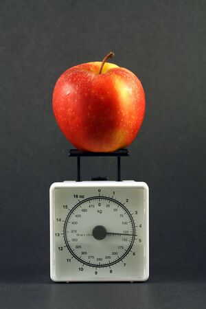 Apple on weight scaleの写真素材
