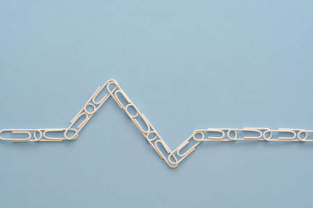 EKG style chart with paper clipsの写真素材