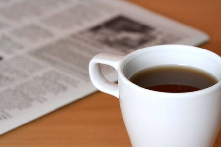 A cup of coffee and a newspaperの写真素材