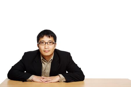 Businessman posing in an office, with copy spaceの写真素材