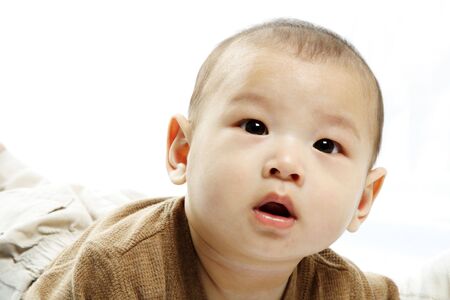 A portrait of a cute baby boyの写真素材