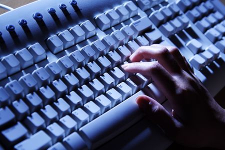 A businesswoman working and typing on her keyboard