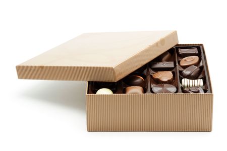 A box of chocolates with the lid openedの写真素材