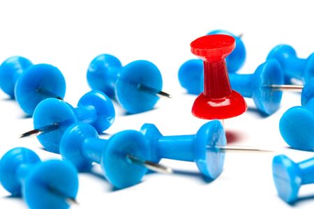 A red push pin among blue push pins (concept of winning)の写真素材