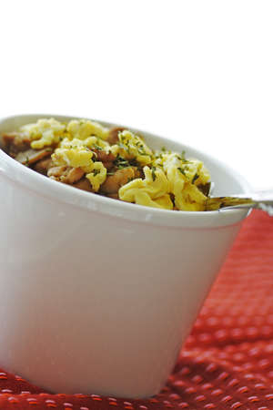 A shot of stir fry chicken, mushroom and egg on top of riceの写真素材