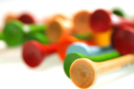 A shot of golf tees on white