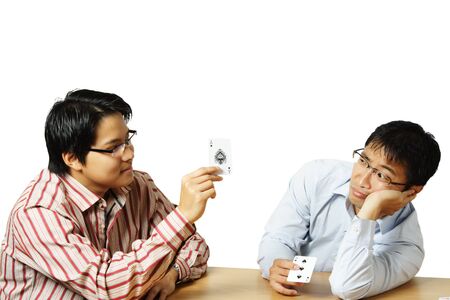 An isolated shot of two men playing cardsのeditorial素材